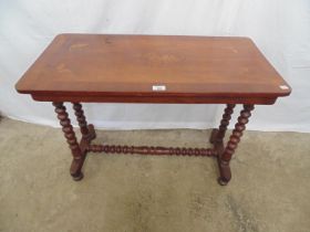 Cross banded inlaid mahogany stretcher hall table the top being inlaid with butterflies and floral