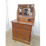 Oak dressing chest having swing frame mirror over single drawer above three long drawers, standing