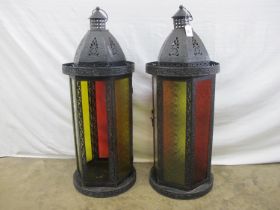Pair of modern black metal lanterns having red and yellow glass panes - 73cm tall each (one pane