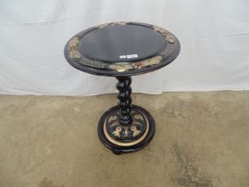 20th century black painted lamp table with carved border having gilt highlights, standing on