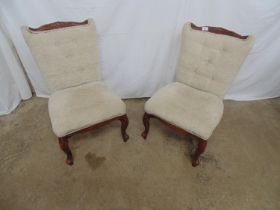 Pair of modern button back bedroom chairs both having a carved cresting rail, padded seat and