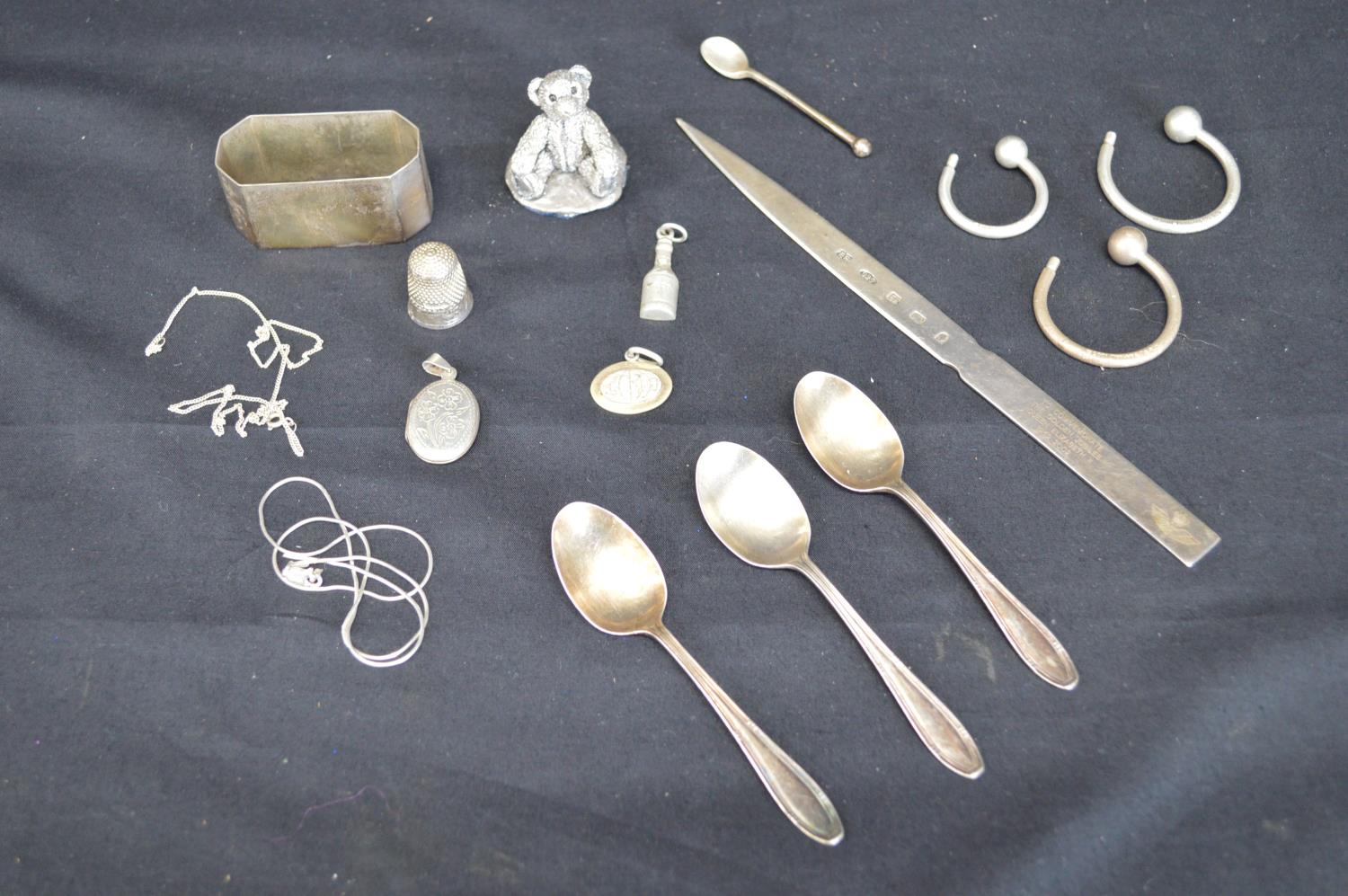 Group of small silver items to include: Golden Jubilee letter opener, locket, napkin ring and silver