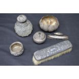 Group of silver and white metal items to include: scent bottles, clothes brush, nail buffer,