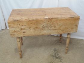 Pine dropleaf table with single drawer, standing on turned legs - 105cm x 54cm x 76cm tall Please