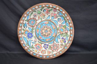 Persian copper charger having enamel decoration of flowers - 40cm dia Please note descriptions are