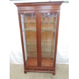 Reproduction inlaid mahogany display cabinet having two astral glazed doors opening to five shelves,