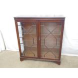 Reproduction mahogany display cabinet the two astral glazed doors opening to two adjustable glass