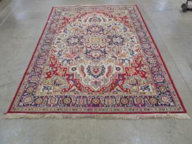 Royal Tabriz red and white ground patterned rug having geometric central design surrounded by