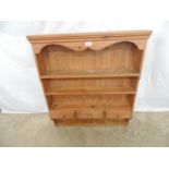 Pine wall shelves with shaped frieze having two shelves over three small drawers and one small