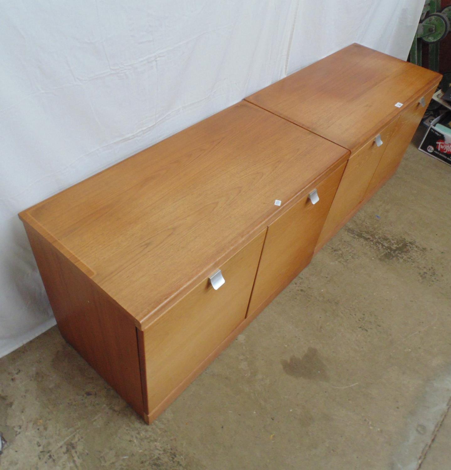 Pair of mid century teak cupboards the two door opening to a single fixed shelf, standing on - Image 2 of 4