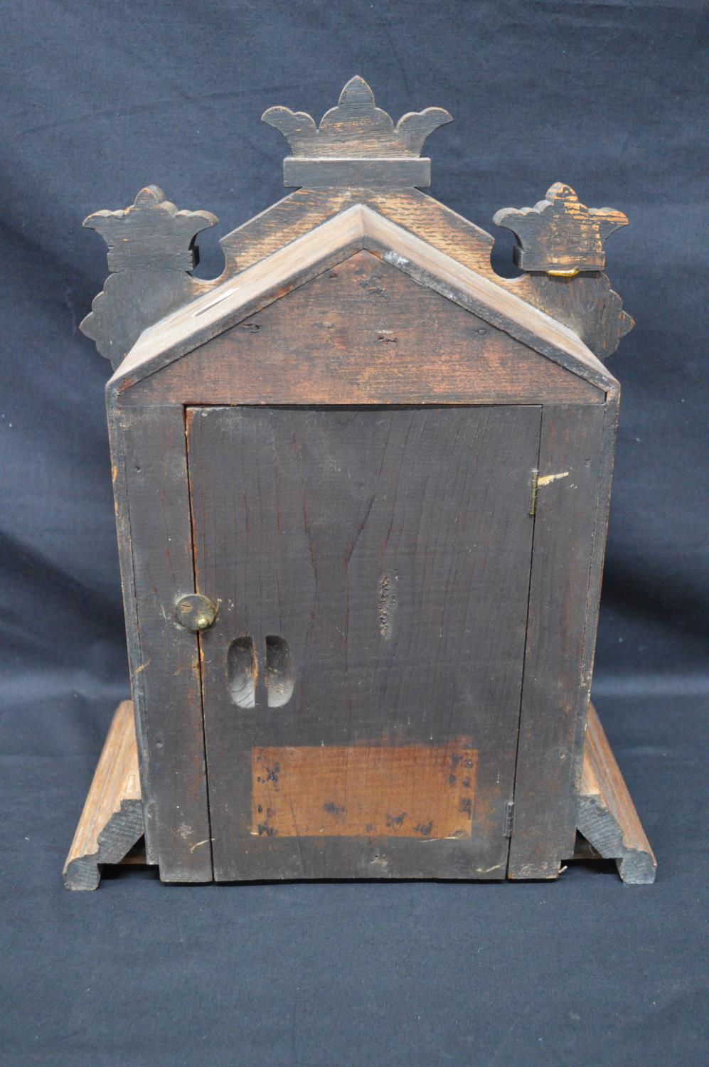 Oak cased mantle clock having some carving to case and standing on stepped base. Black hands and - Image 3 of 5