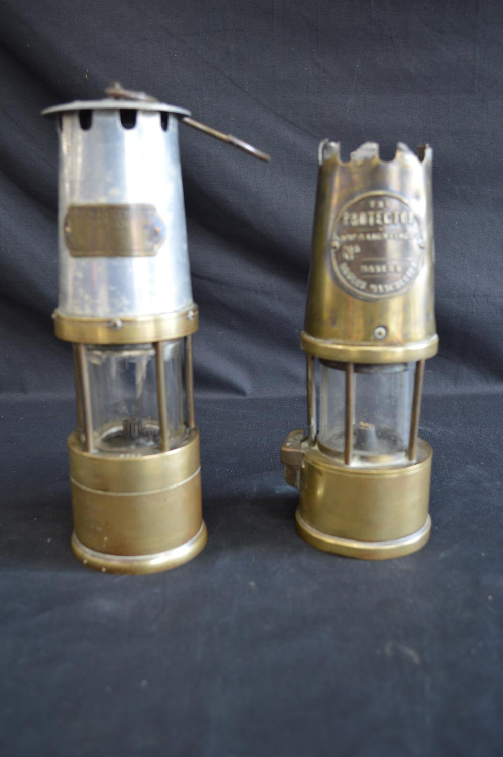 JH Naylor Ltd brass and aluminium No. 6290 miners inspection lamp together with a Protector brass