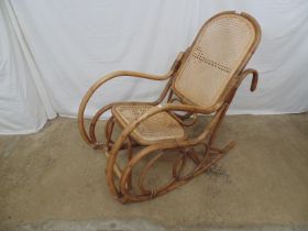 Bamboo rocking chair with cane seat and back having ornate rocker supports - 55cm x 105cm x 104cm