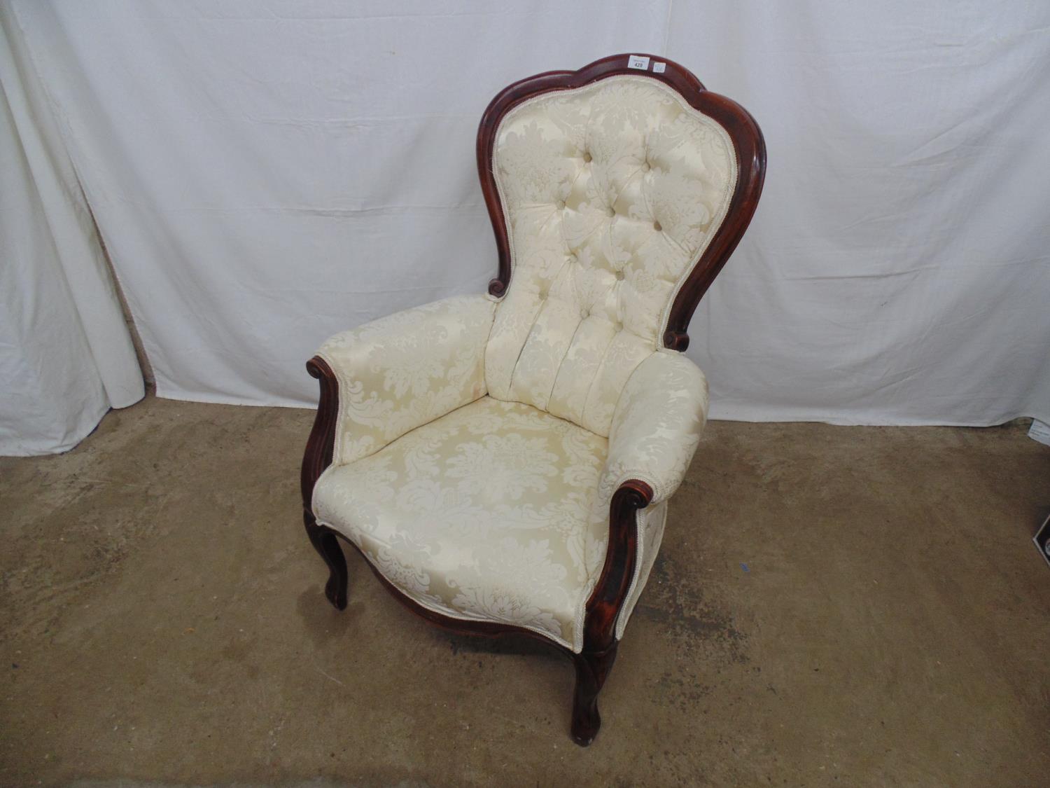 Reproduction button back armchair having cream/white upholstery, standing on cabriole front legs -