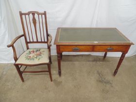 Mahogany writing desk having green leather insert to top over two drawers, standing on turned