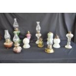 Group of eleven various oil lamps (some missing burners and no shades) Please note descriptions