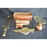 Group of brass and copper ware to include: copper foot warmer, Guernsey cream jug, brass trivet