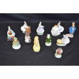 Group of eleven Coalport animal figures to include: rabbits, hare and hedgehog etc Please note