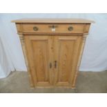 Victorian pine Continental style cupboard having a rectangular top over single drawer with two