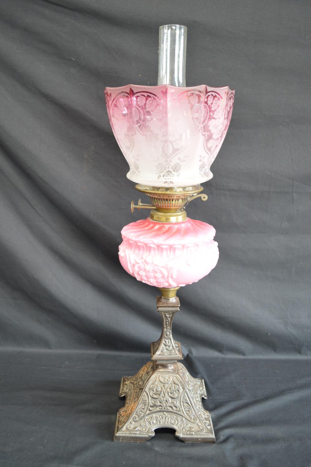 Victorian iron based oil lamp with pink glass reservoir and Cranberry glass shade - 69cm tall