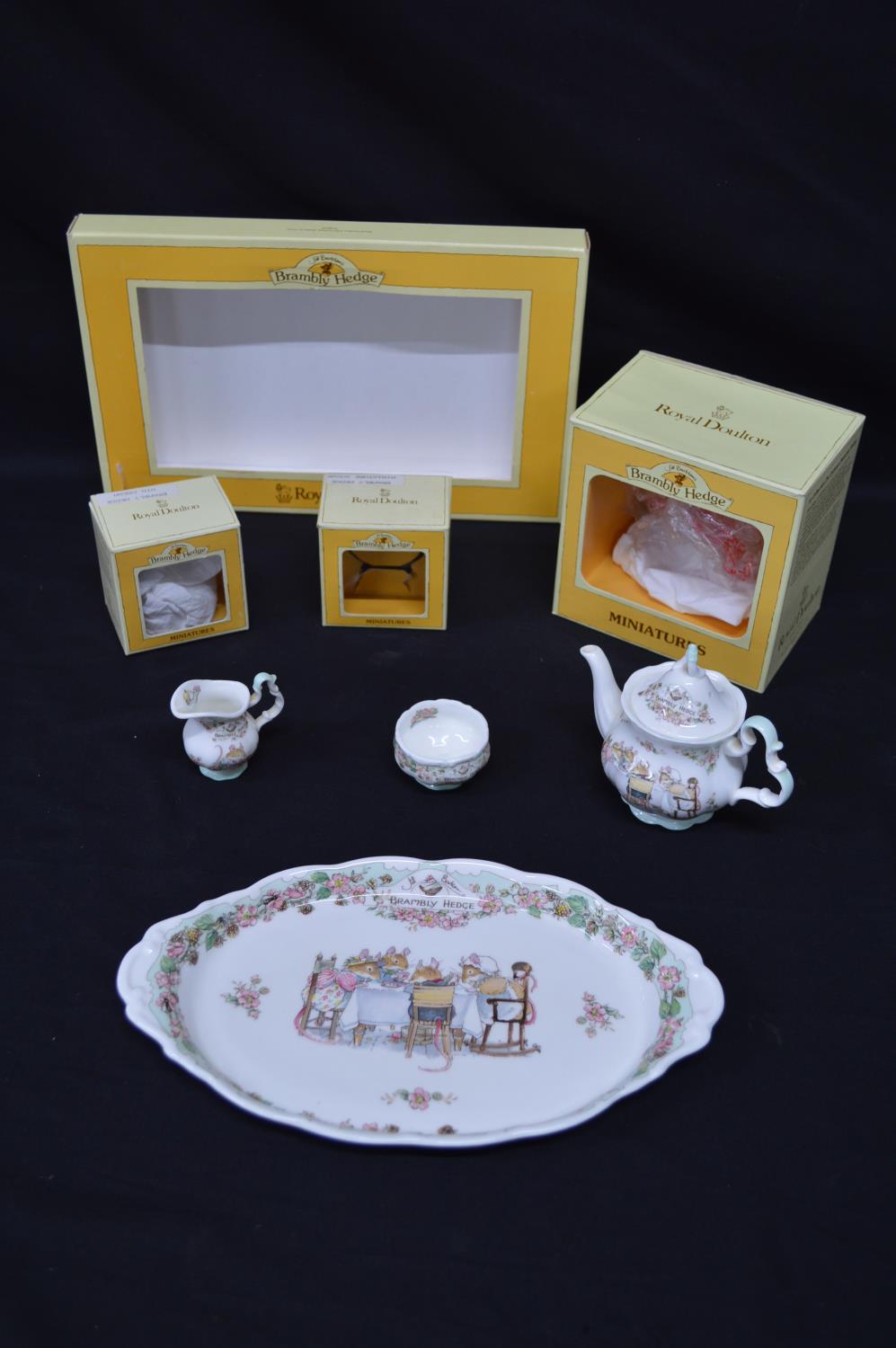 Royal Doulton Bramley Hedge miniature four piece tea set to comprise: oval serving tray, teapot,