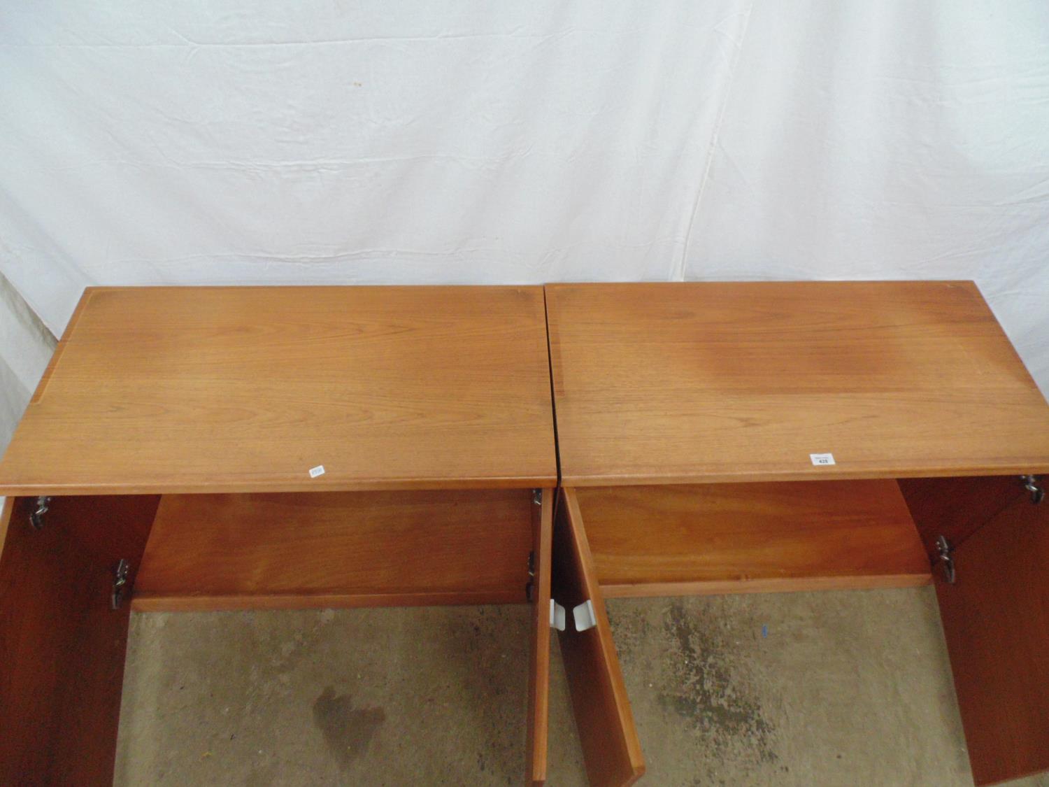 Pair of mid century teak cupboards the two door opening to a single fixed shelf, standing on - Image 4 of 4