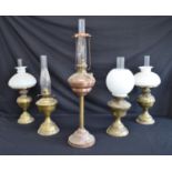 Group of five various brass and copper oil lamps - tallest 75cm including chimney Please note
