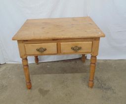 Victorian pine table having three plank top over two short drawers, standing on turned legs - 92cm x