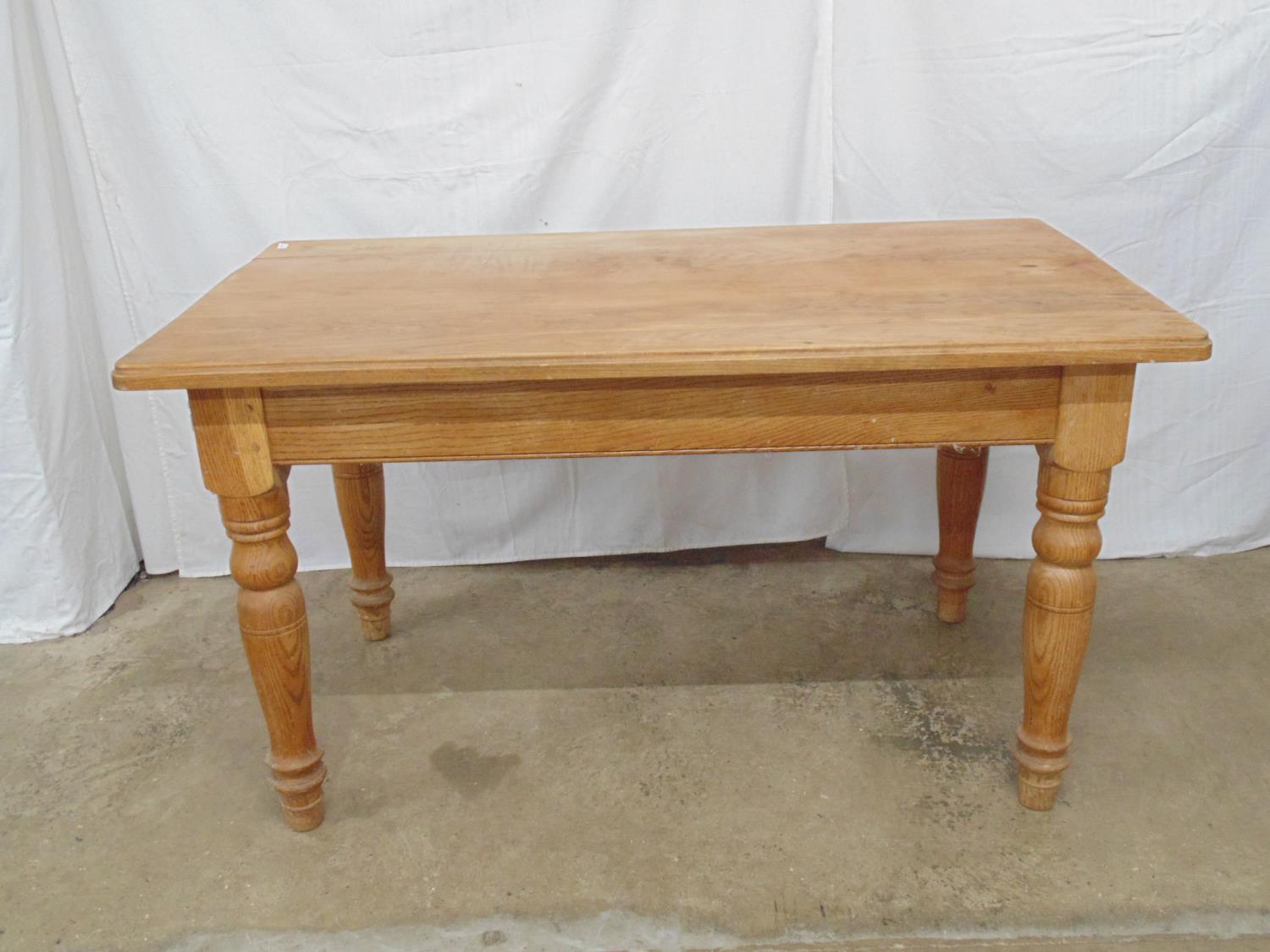 Oak kitchen table having a five plank rectangular top, standing on turned legs - 136cm x 76cm x 76cm