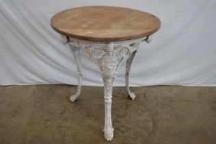 Iron based circular table having wooden top supported by pierced frieze with Britannia figures,