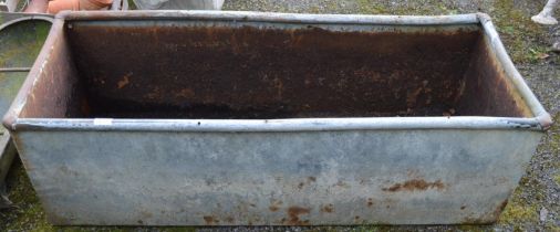 Galvanised water tank with drainage holes - 124cm x 49cm x 39cm tall Please note descriptions are