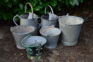 Four galvanised buckets together with two galvanised watering cans Please note descriptions are