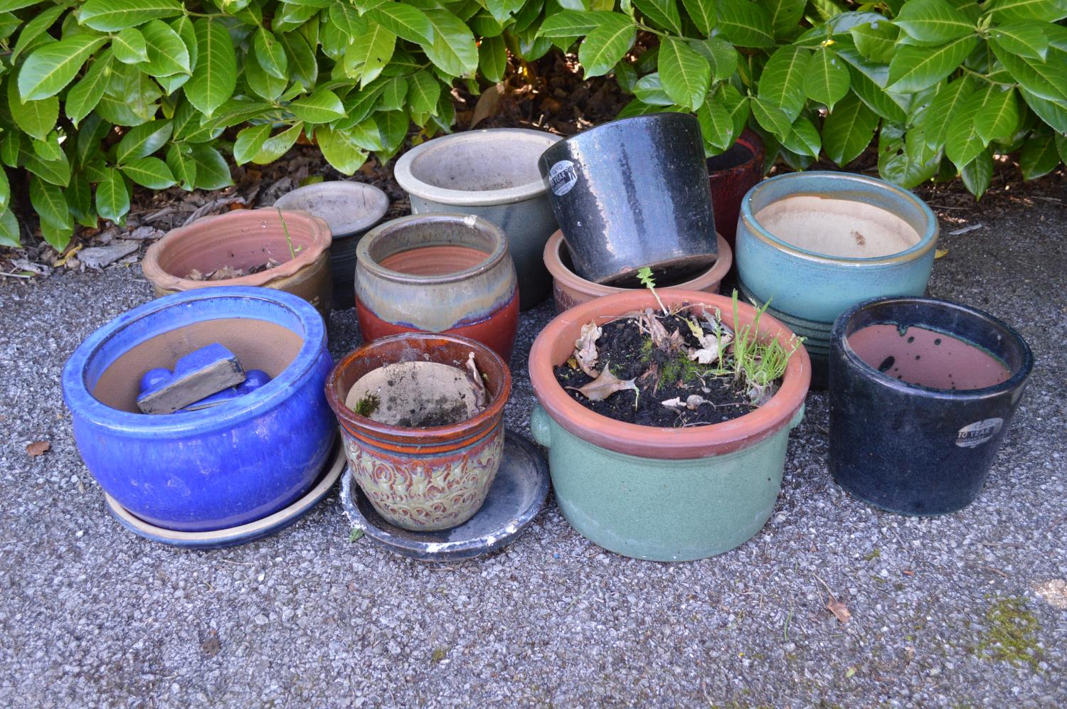 Group of twelve various style glazed plant pots of varying sizes Please note descriptions are not