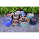 Group of twelve various style glazed plant pots of varying sizes Please note descriptions are not