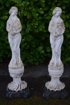 Pair of statues of young ladies, standing on plinth bases - 32cm x 115cm tall Please note