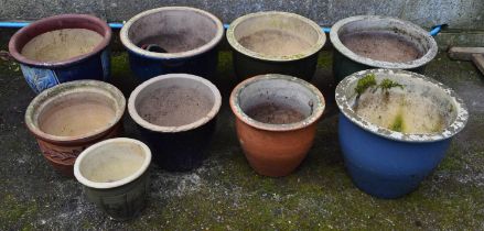 Group of nine glazed plant pots of varying sizes Please note descriptions are not condition reports,