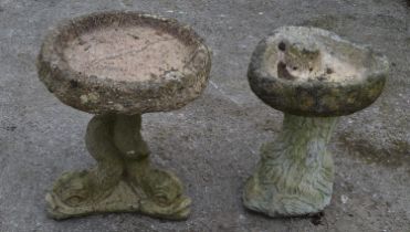 Two small bird baths with tree and fish formed bases - 41cm and 45cm tall Please note descriptions