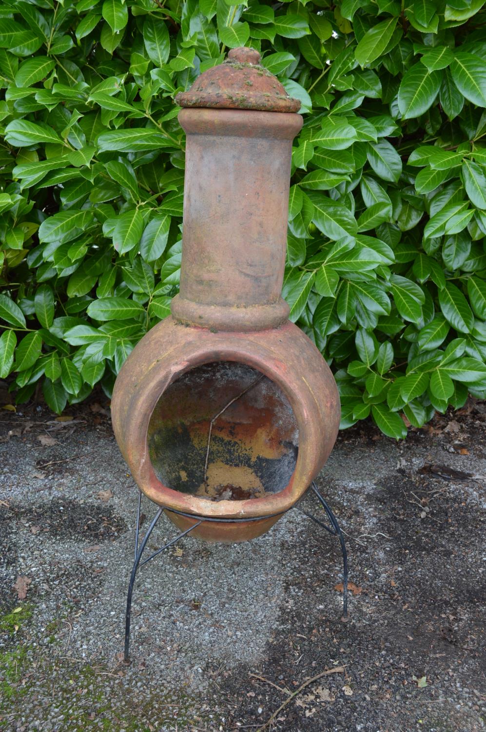 Terracotta effect chiminea on metal stand - 45cm x 115cm tall Please note descriptions are not
