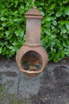 Terracotta effect chiminea on metal stand - 45cm x 115cm tall Please note descriptions are not