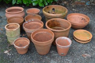 Group of twelve terracotta plant pots together with three dishes of various sizes - largest 39cm x