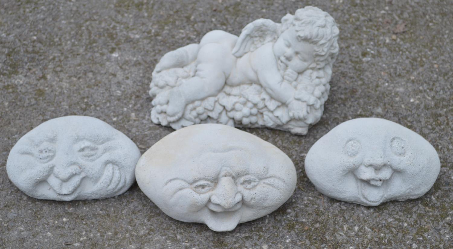 Set of three happy face garden ornaments together with a cherub ornament - 28cm wide Please note
