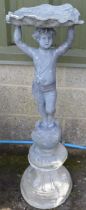 Lead shell top bird bath, the bowl being supported by young boy and standing on later concrete