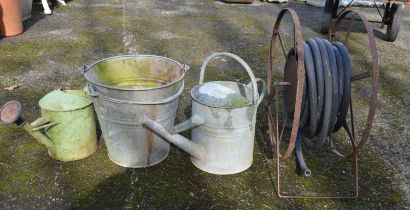 Metal hose reel, two galvanised buckets and two watering cans Please note descriptions are not