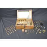 Box containing a quantity of old keys, weights and brass fittings etc Please note descriptions are