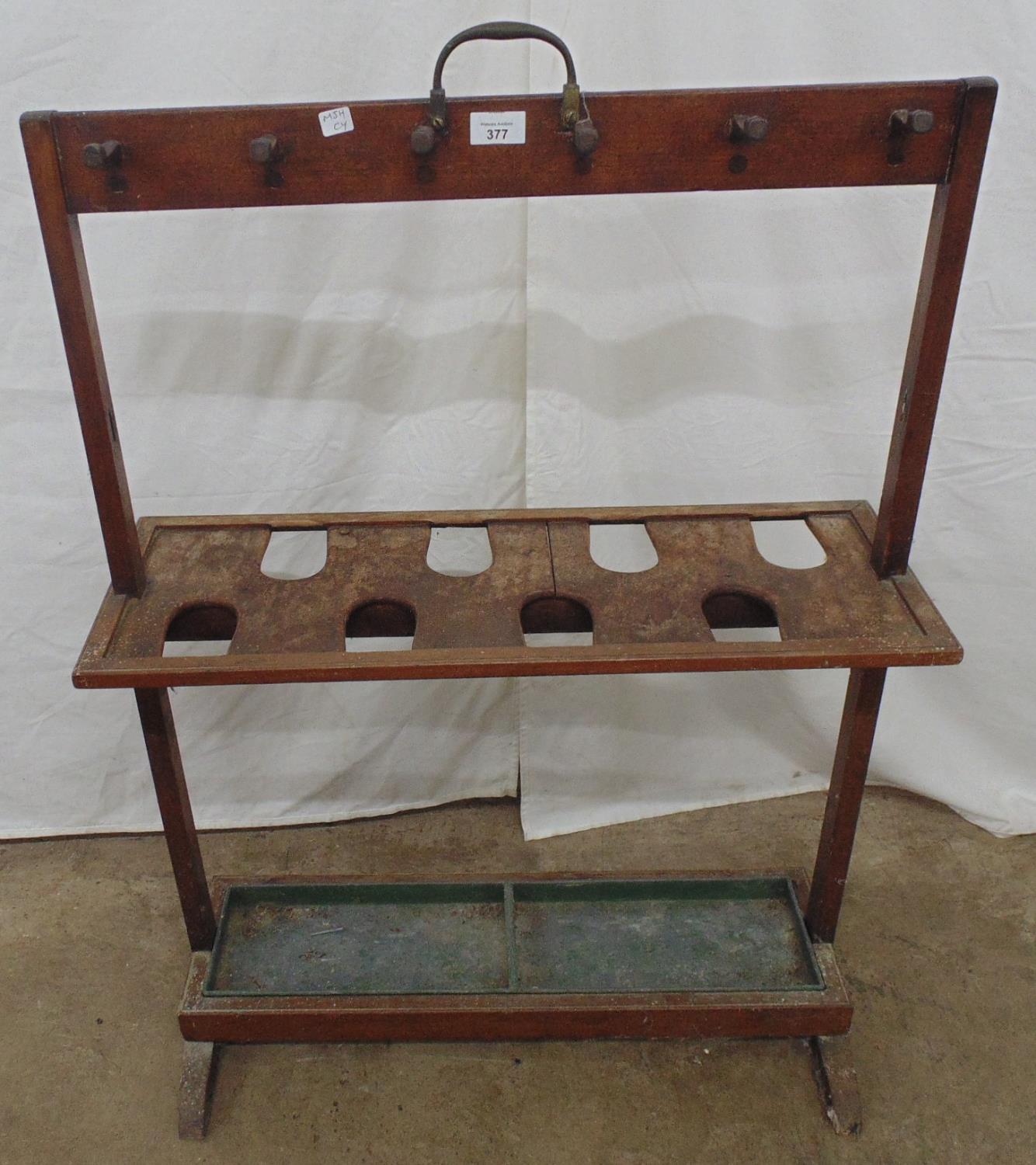 Small umbrella/coat stand with carry handle to top, twelve coat pegs over shelf with eight