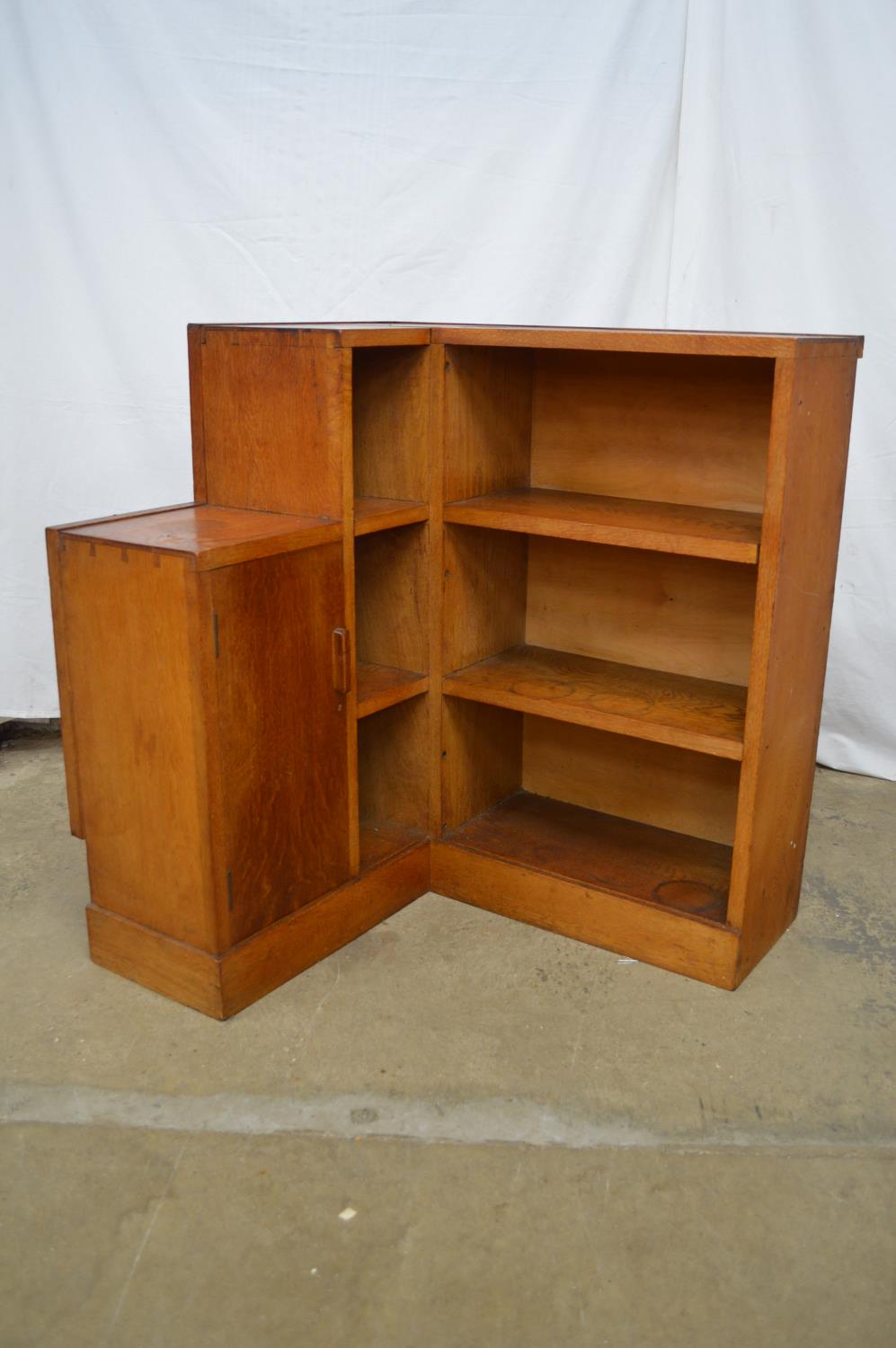 Oak corner bookcase having four fixed shelves and single cupboard door enclosing single shelf - 74cm - Image 2 of 3