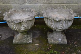 Pair of acanthus/cabbage leaf formed urns standing on square bases - 48.5cm x 41cm tall Please