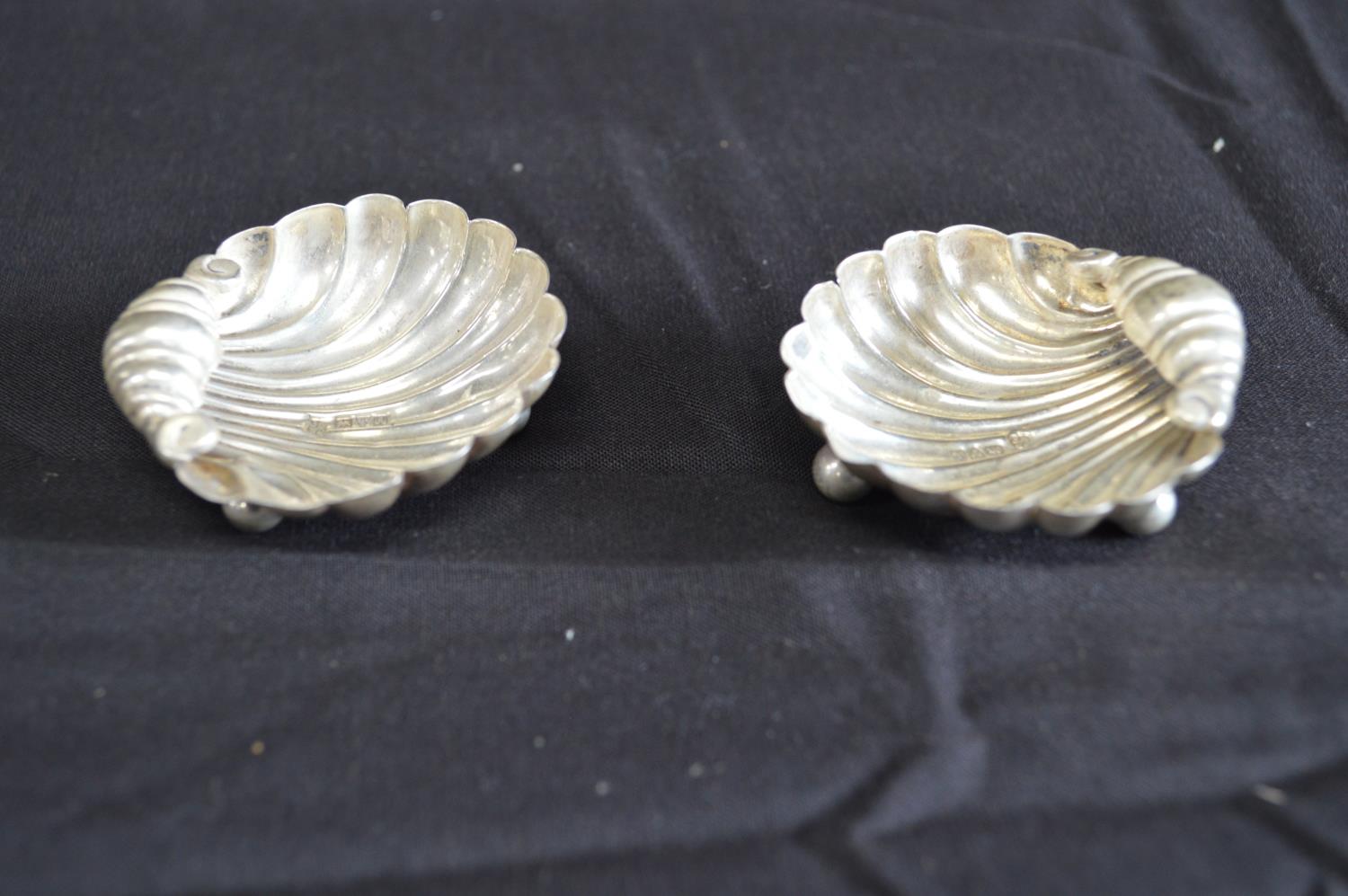 Pair of shell formed silver salts each standing on ball and ball feet, hallmarked for Chester (0. - Image 2 of 5