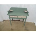 Painted washstand the three quarter gallery back over two short drawers, standing on turned supports