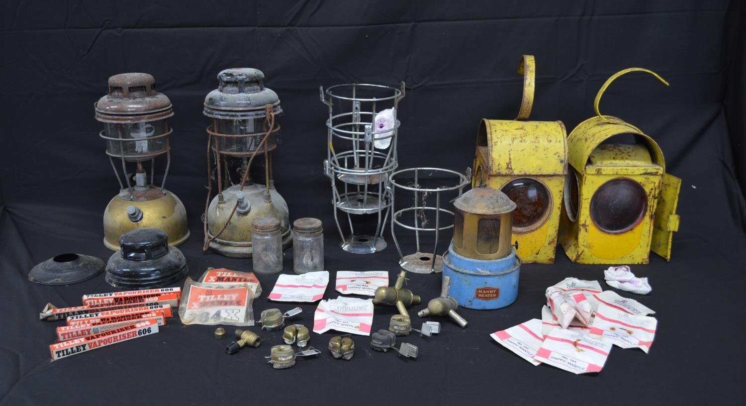 Two vintage yellow paraffin road work lamps together with two Tilley lamps and a quantity of